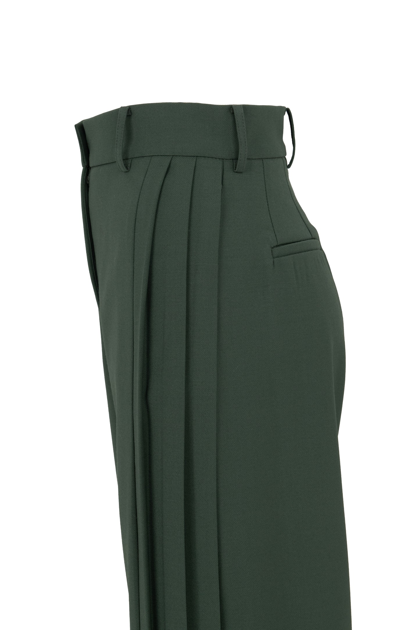 Side view of tailored flare trousers in virgin wool with deep side pleats and high waist. Soft structure and elegant movement. Botteghe Oscure, Made in Italy.