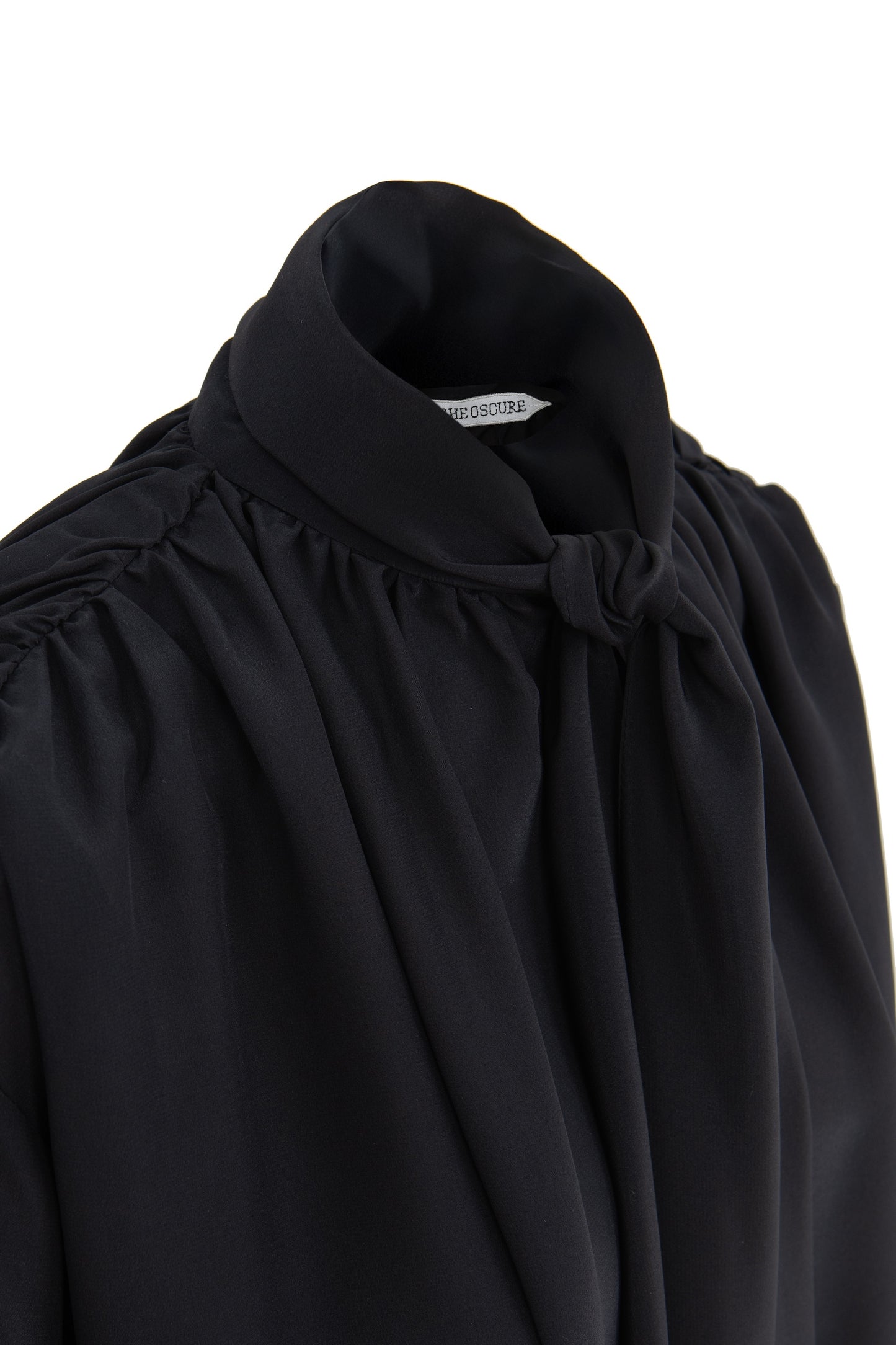 Detail of silk crepe de chine blouse with lavallière bow and ruched shoulders in black by Botteghe Oscure