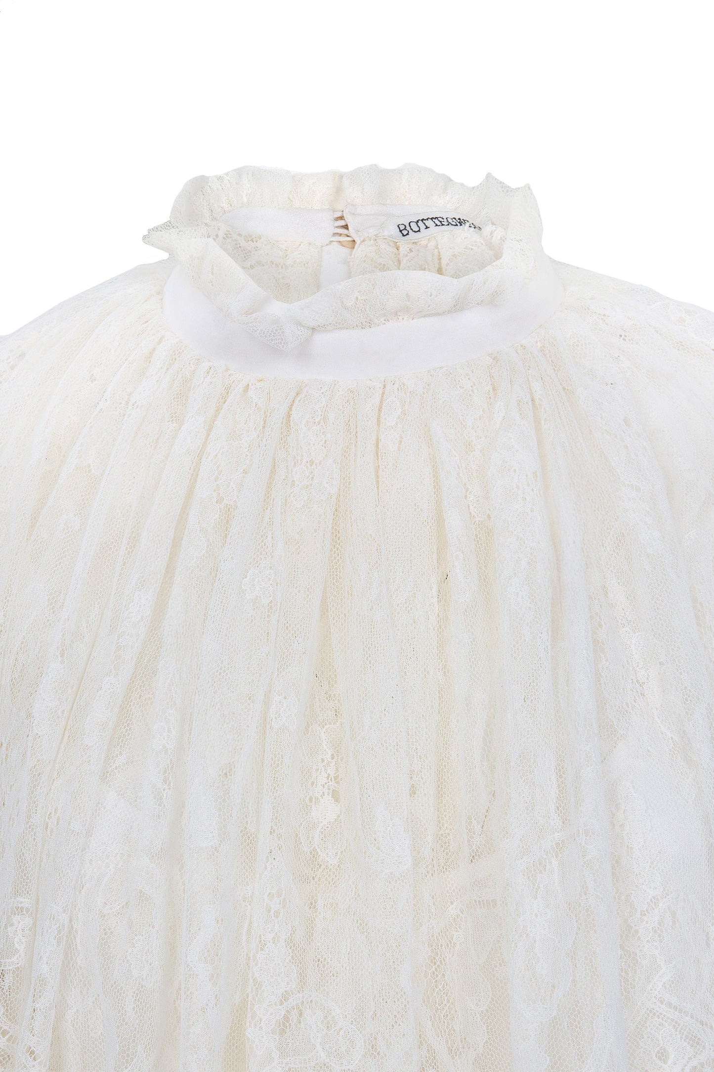 Botteghe Oscure dress in French Chantilly lace with draped lace capelet and silk details