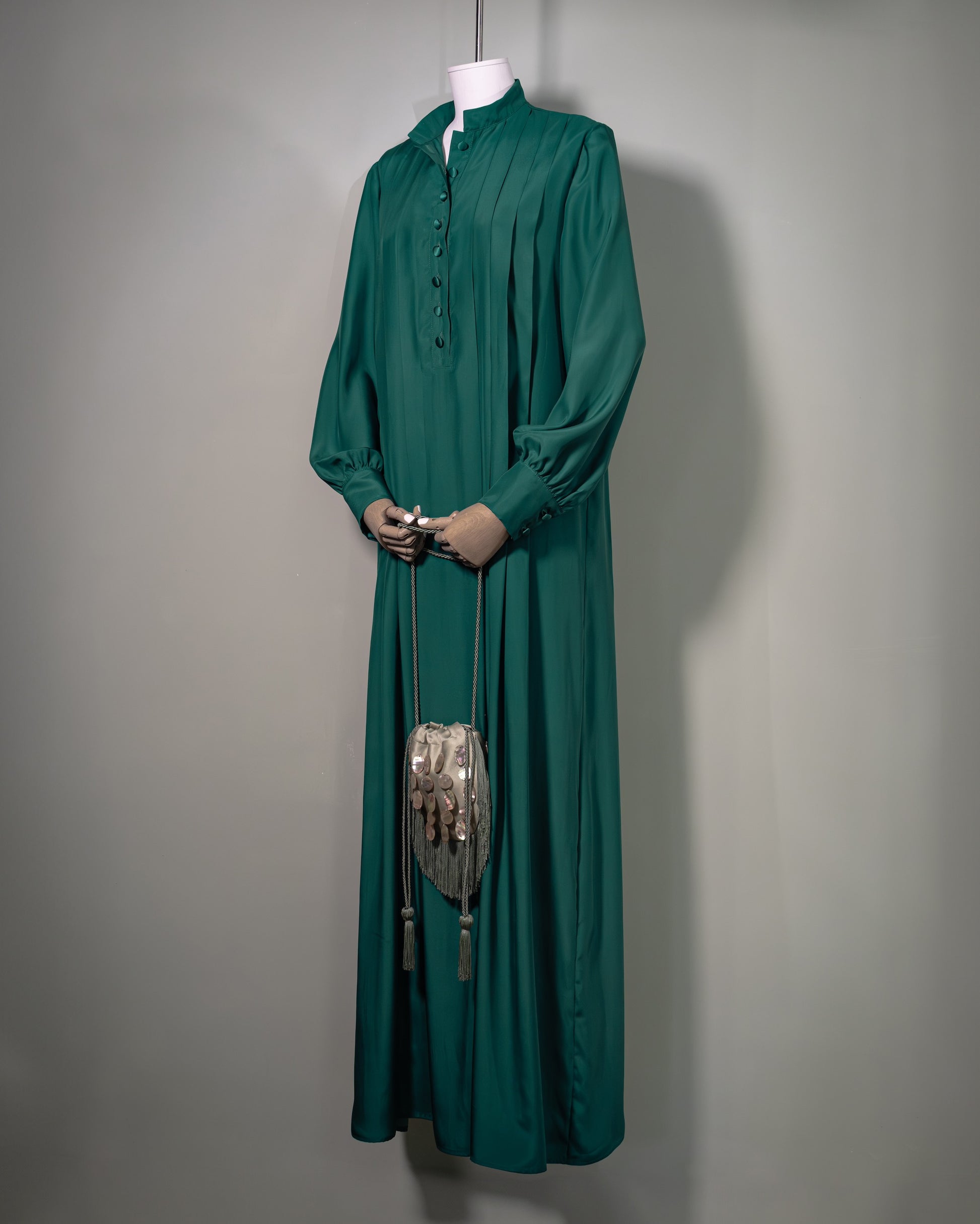 Botteghe Oscure green long pleated silk dress in 100% silk satin, side view front.