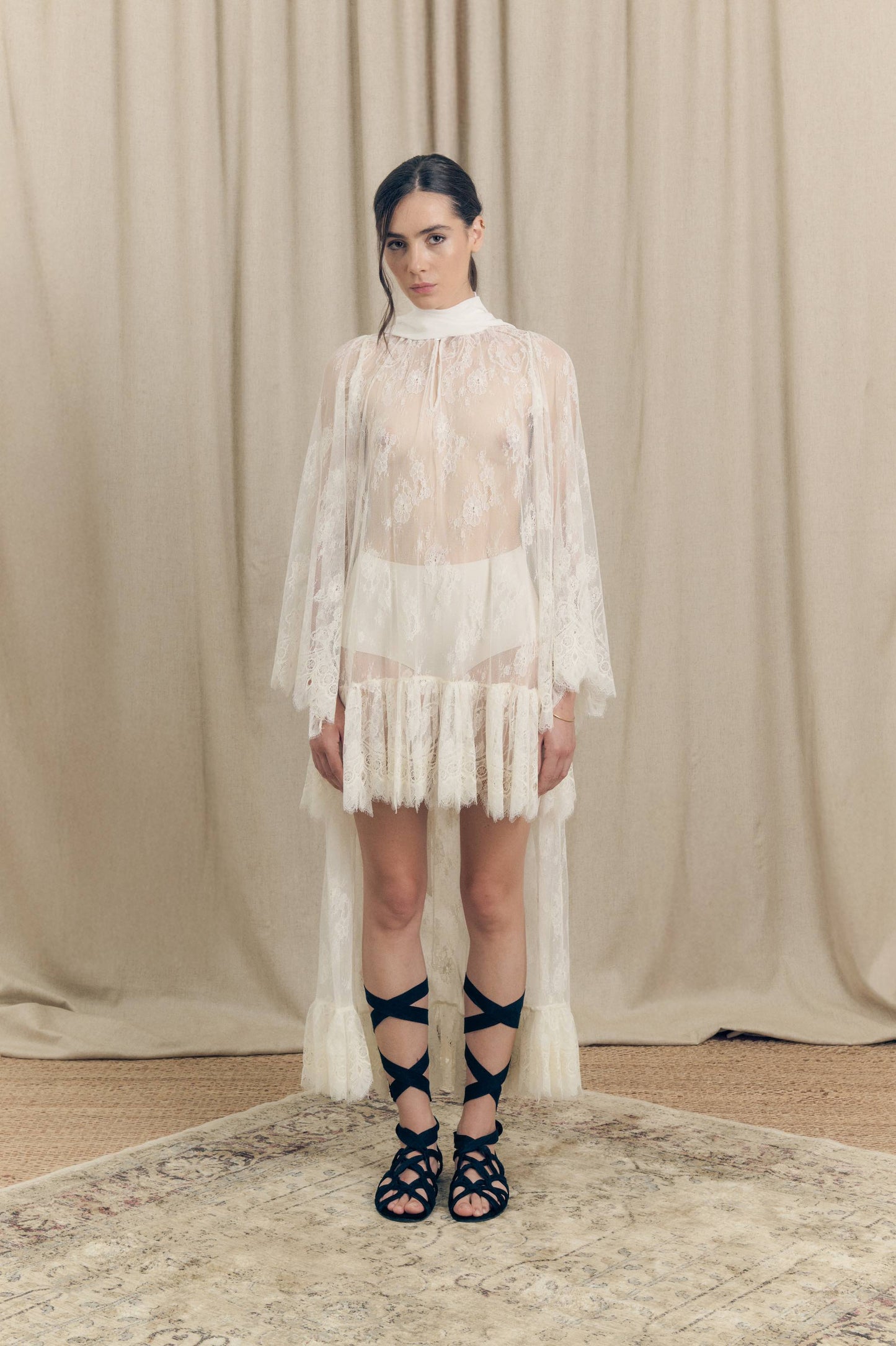 Model wearing Botteghe Oscure asymmetrical French Chantilly lace dress with silk scarf – front view