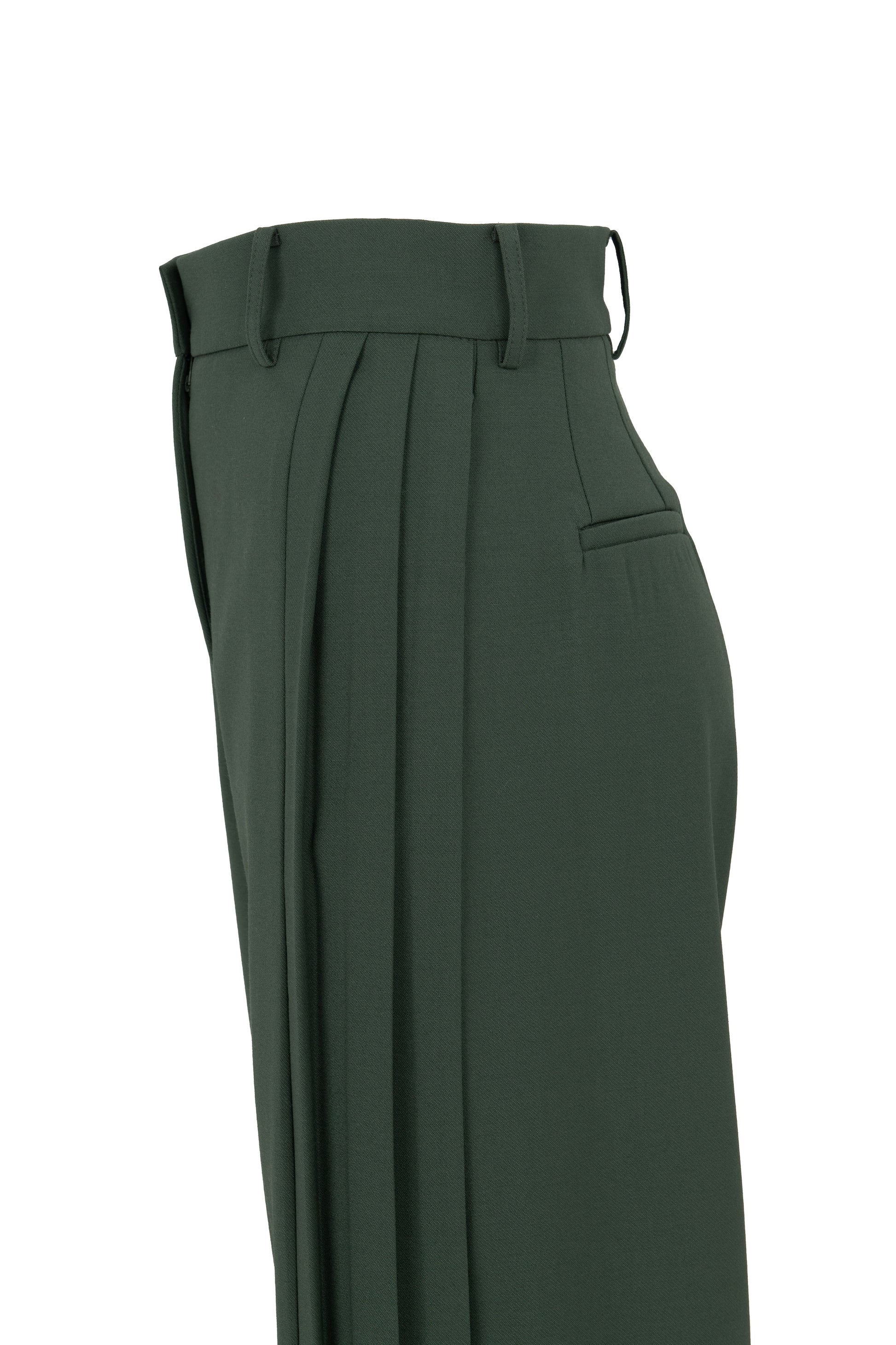 Side view of tailored flare trousers in virgin wool with deep side pleats and high waist. Soft structure and elegant movement. Botteghe Oscure, Made in Italy.
