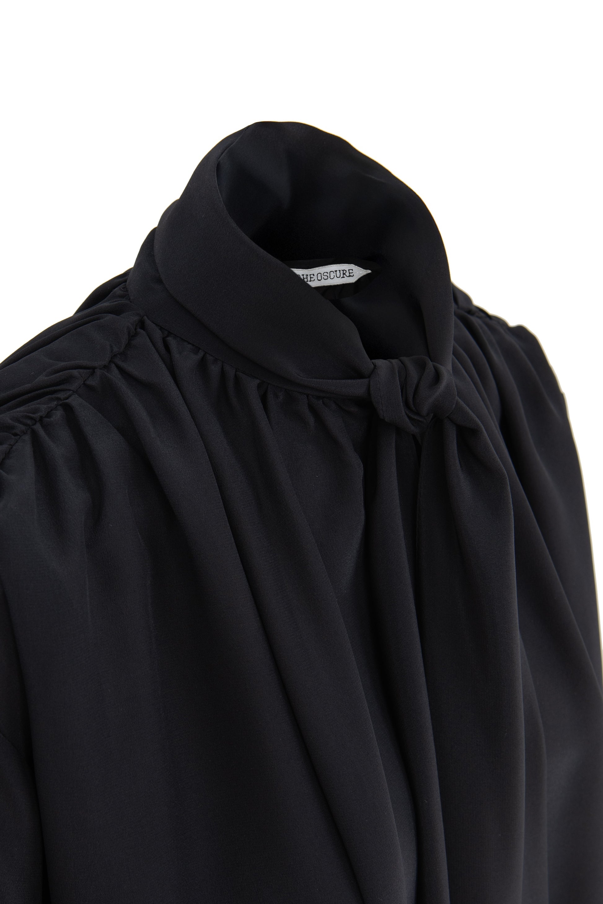 Detail of silk crepe de chine blouse with lavallière bow and ruched shoulders in black  by Botteghe Oscure