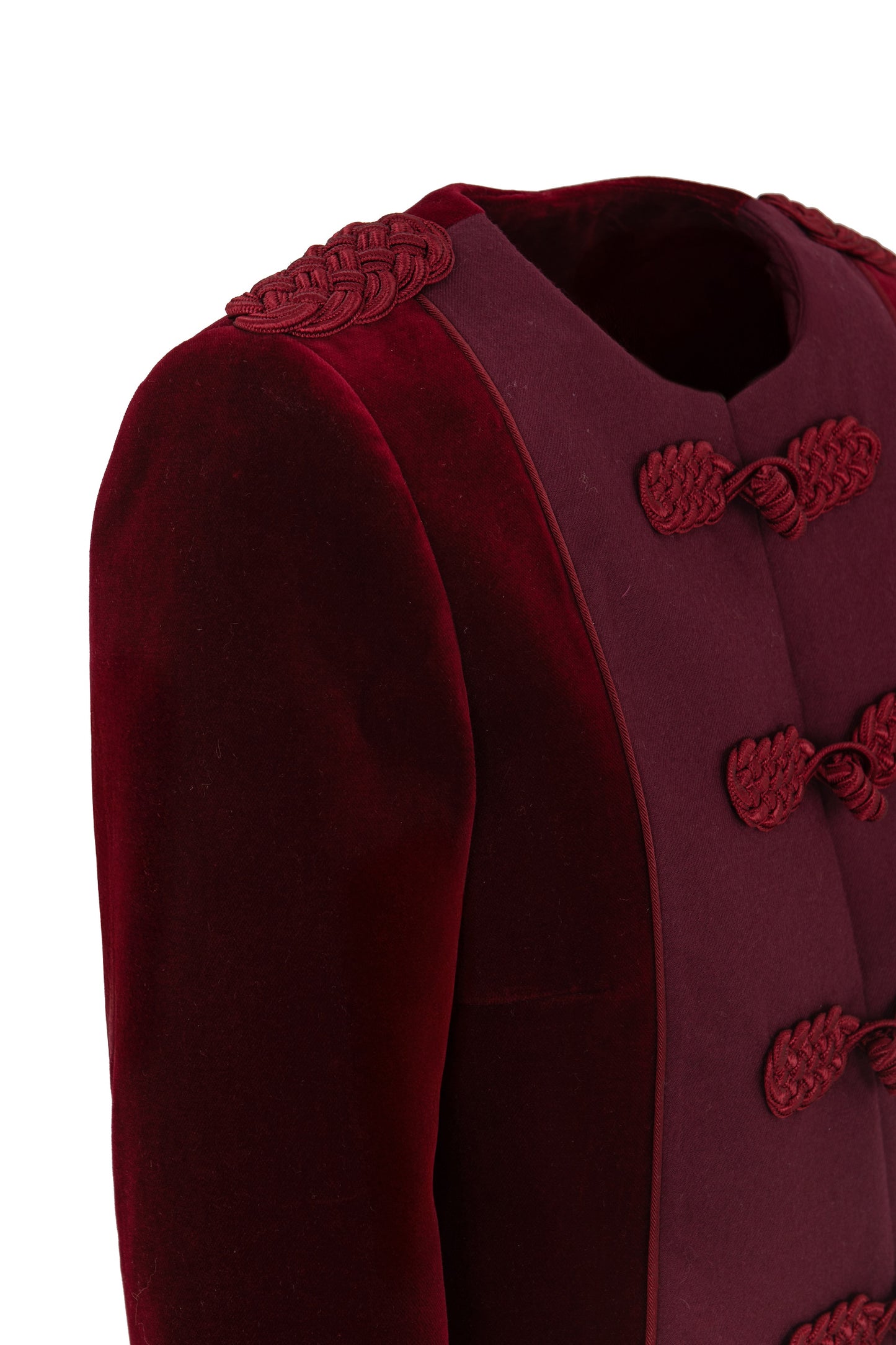 Detail of Botteghe Oscure Brandebourg jacket showing handcrafted braided frog closures and flannel plastron with soutache trims.