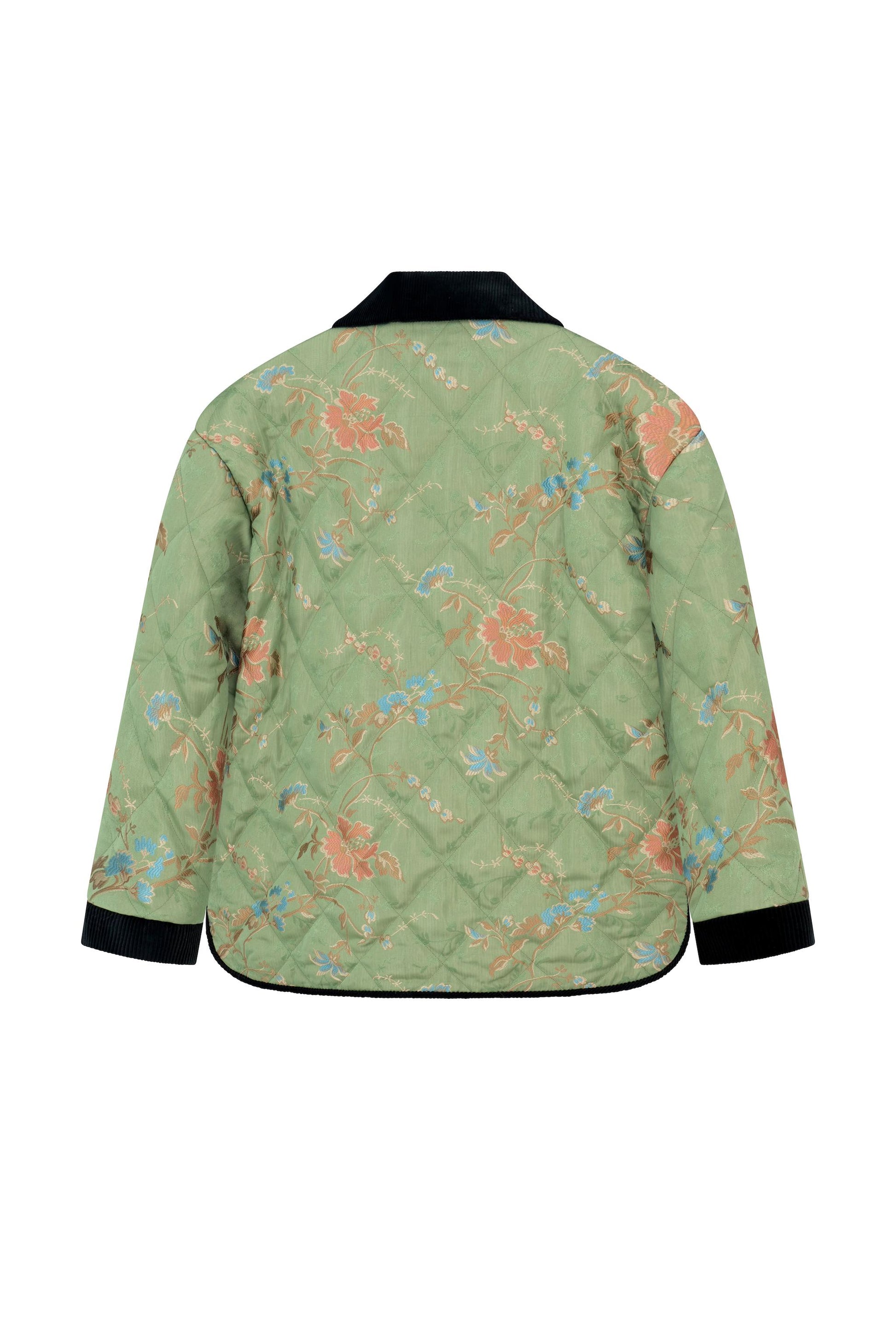 Back view of the Botteghe Oscure quilted jacket featuring a green floral lampas pattern inspired by antique chinoiseries.