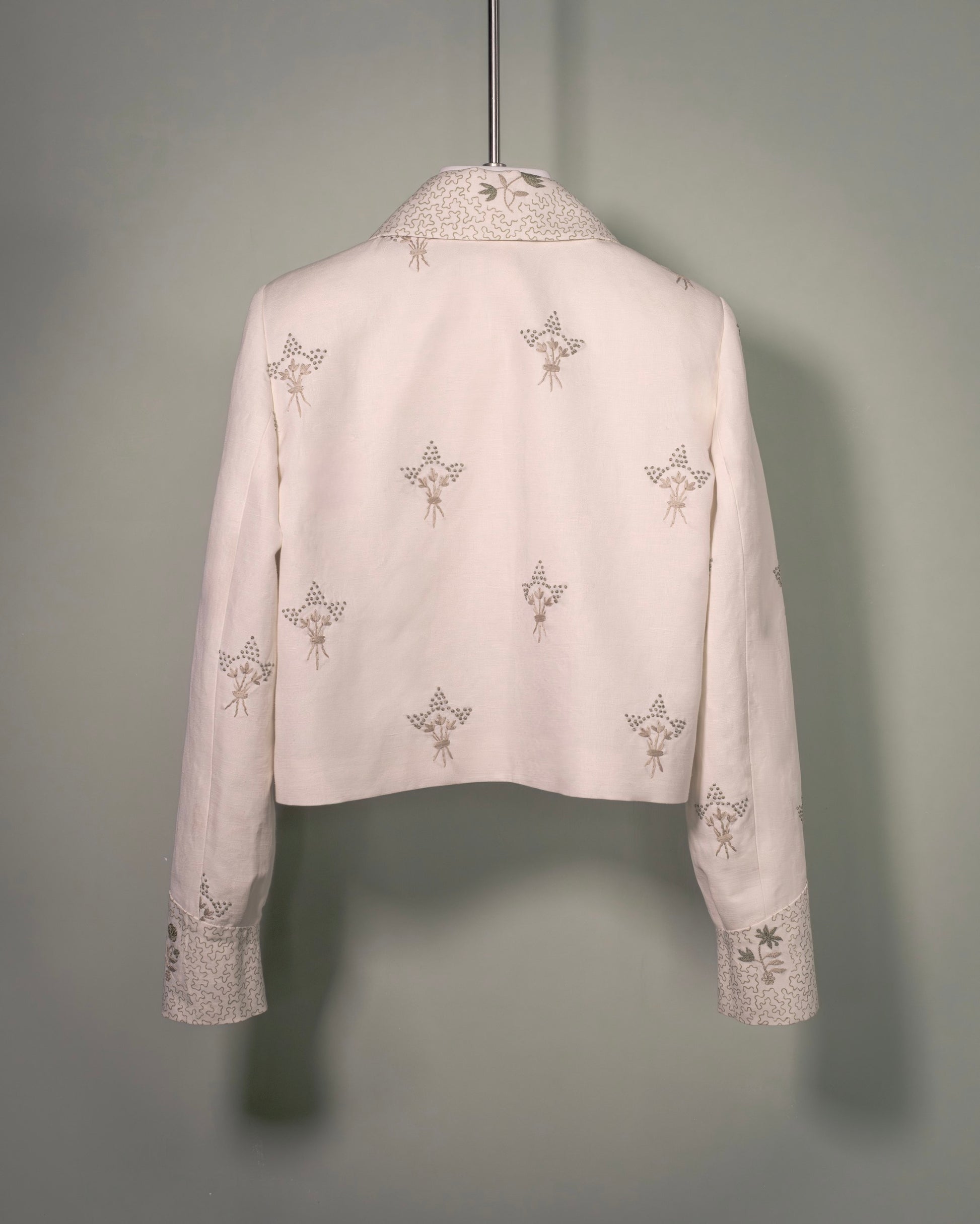 Botteghe Oscure Carré Jacket in archival English linen with hand-embroidered floral bouquets, back view.