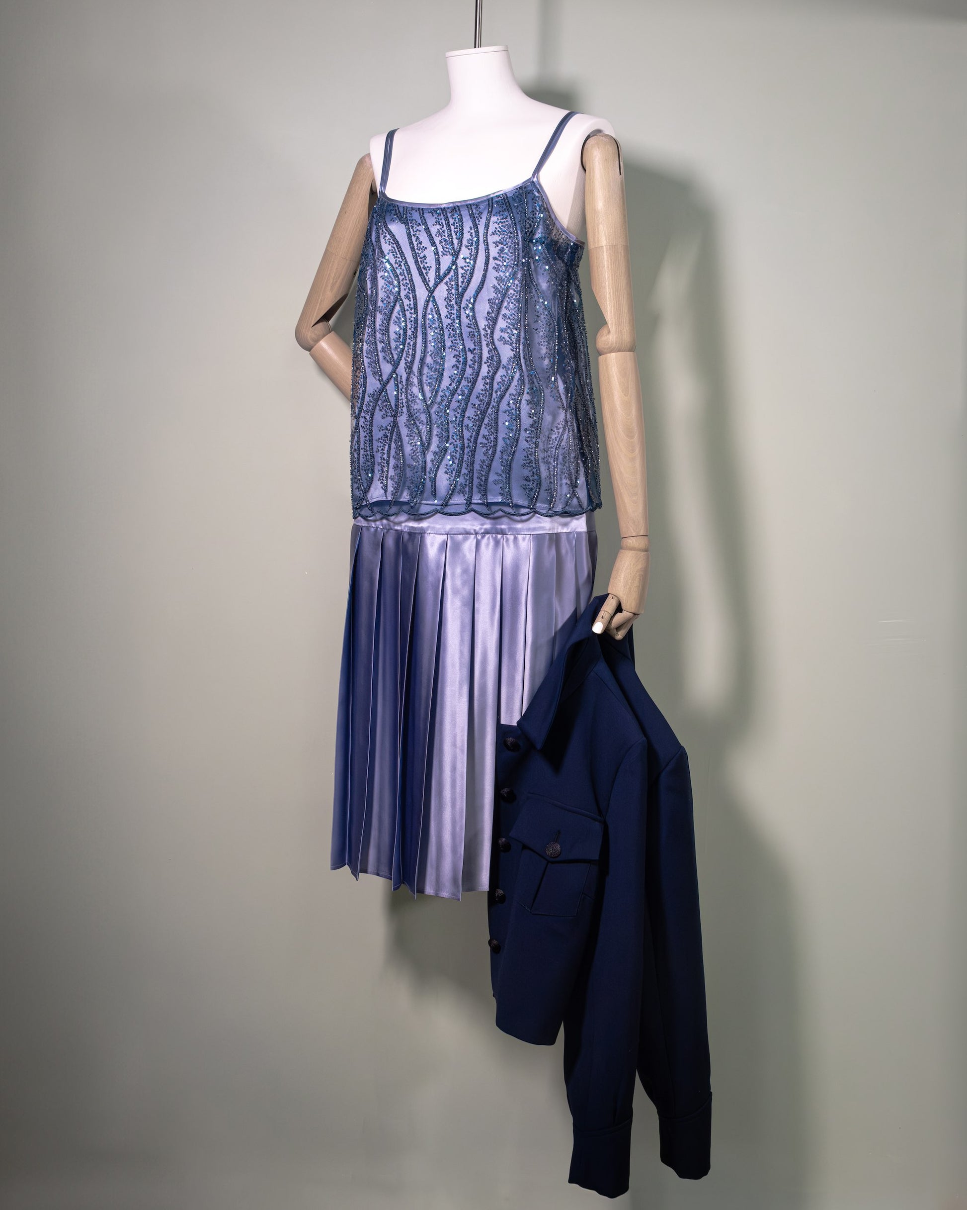 Botteghe Oscure embroidered top styled with Academia pleated silk satin powder blue skirt. Front.