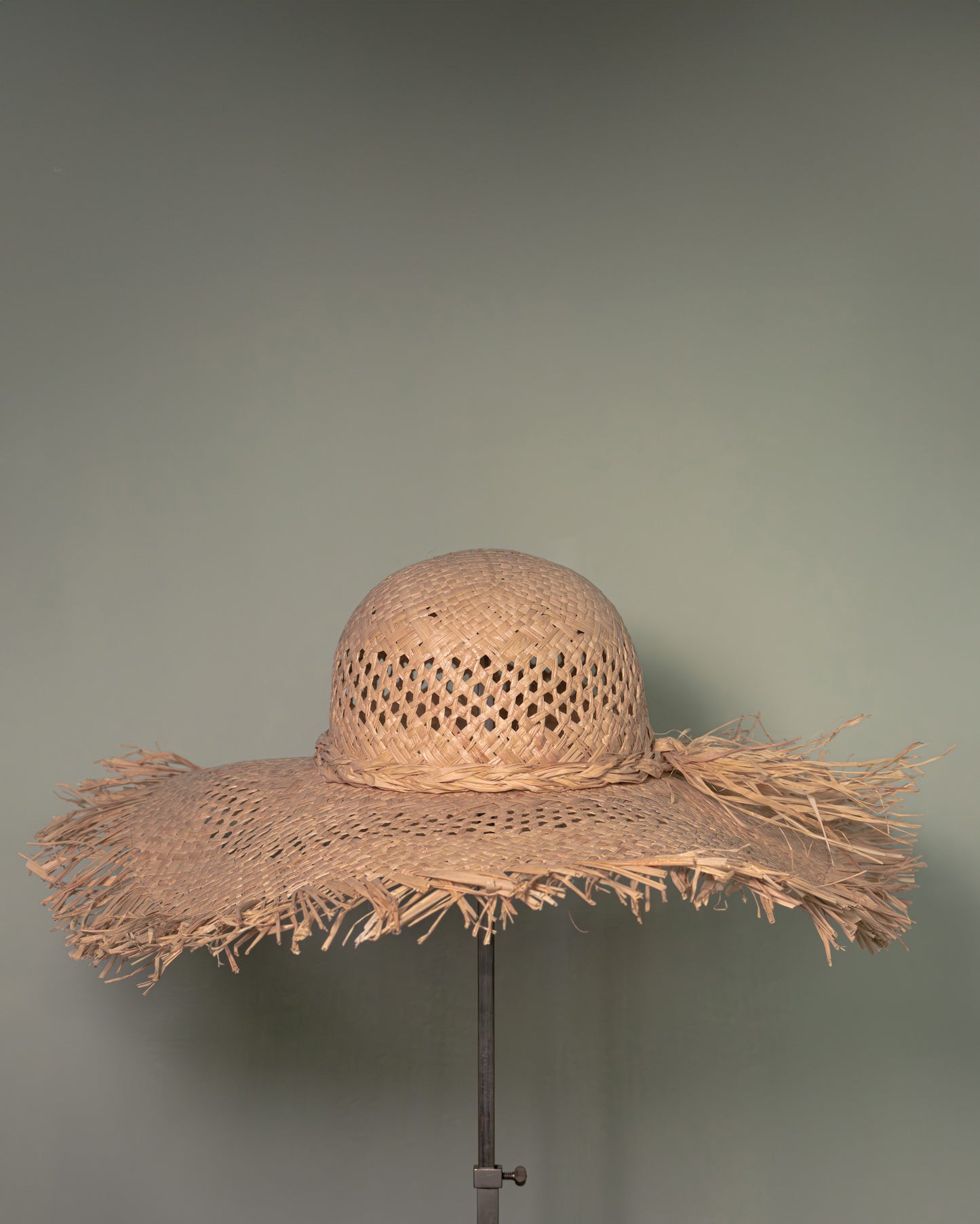 Handmade straw hat in Vienna straw with wide fringed brim, crafted in Tuscany by Botteghe Oscure.