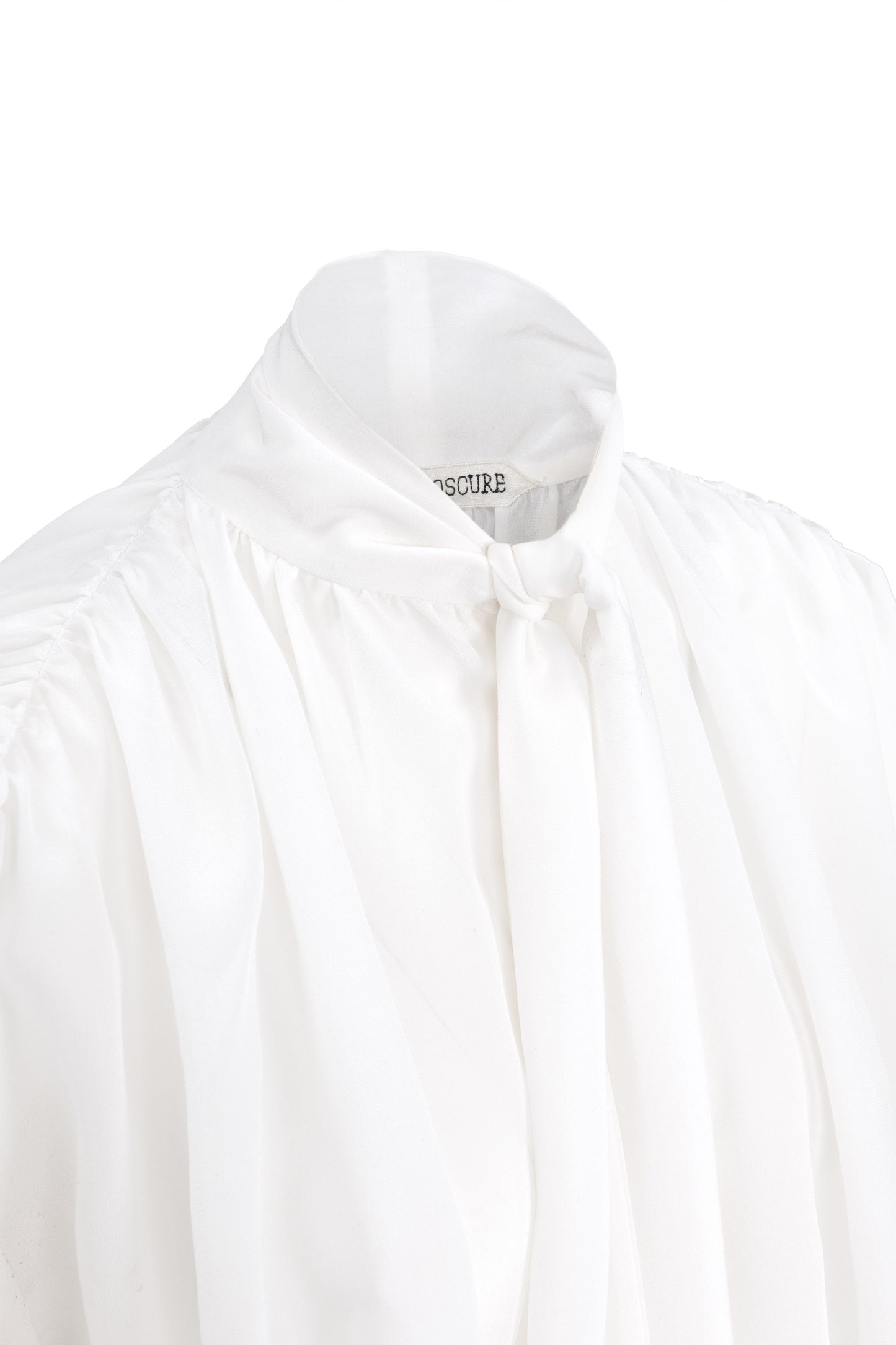 Detail of silk crepe de chine blouse with lavallière bow and ruched shoulders in white by Botteghe Oscure