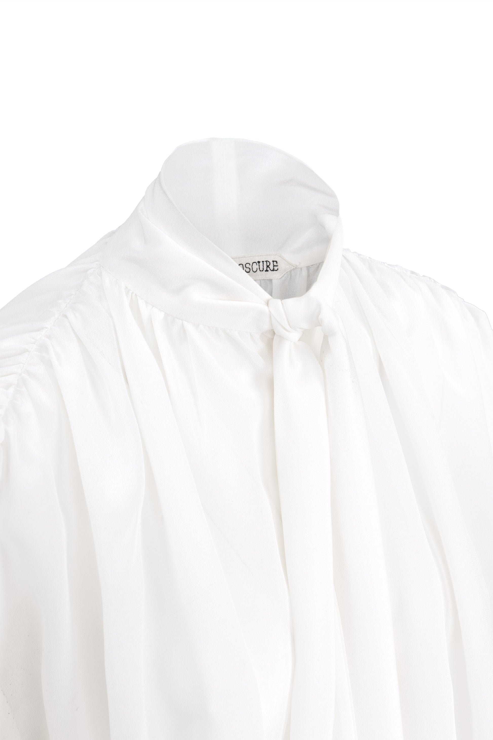 Detail of silk crepe de chine blouse with lavallière bow and ruched shoulders in white by Botteghe Oscure