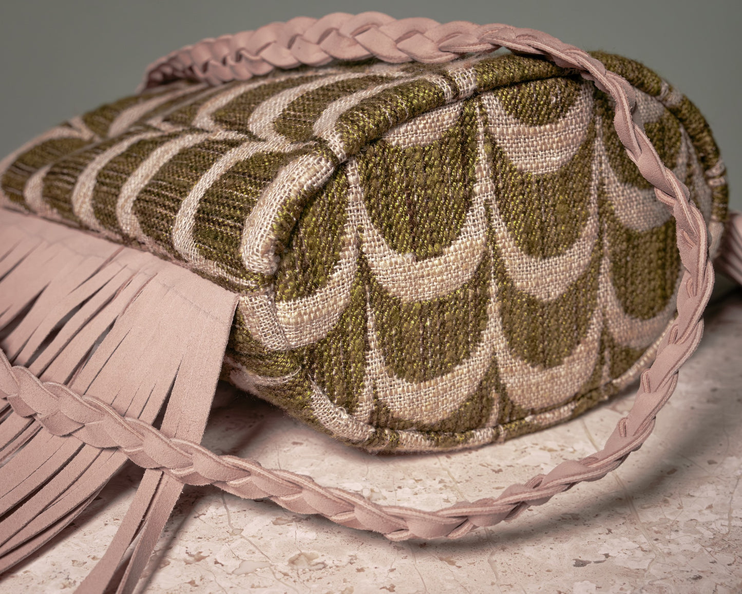 Bottom view showing the handcrafted construction of the Palmette Archive Bucket Bag.