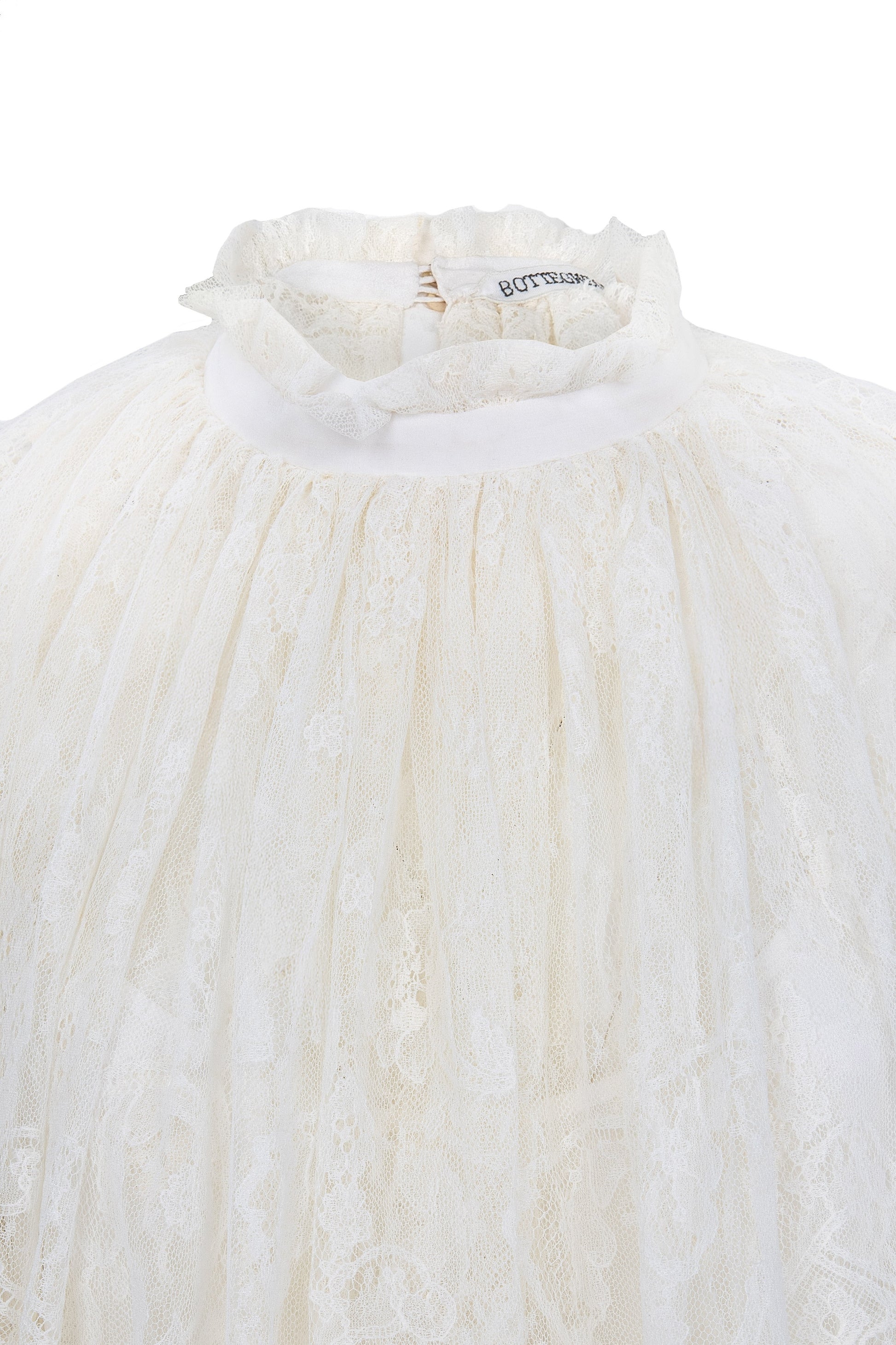 Botteghe Oscure dress in French Chantilly lace with draped lace capelet and silk details 