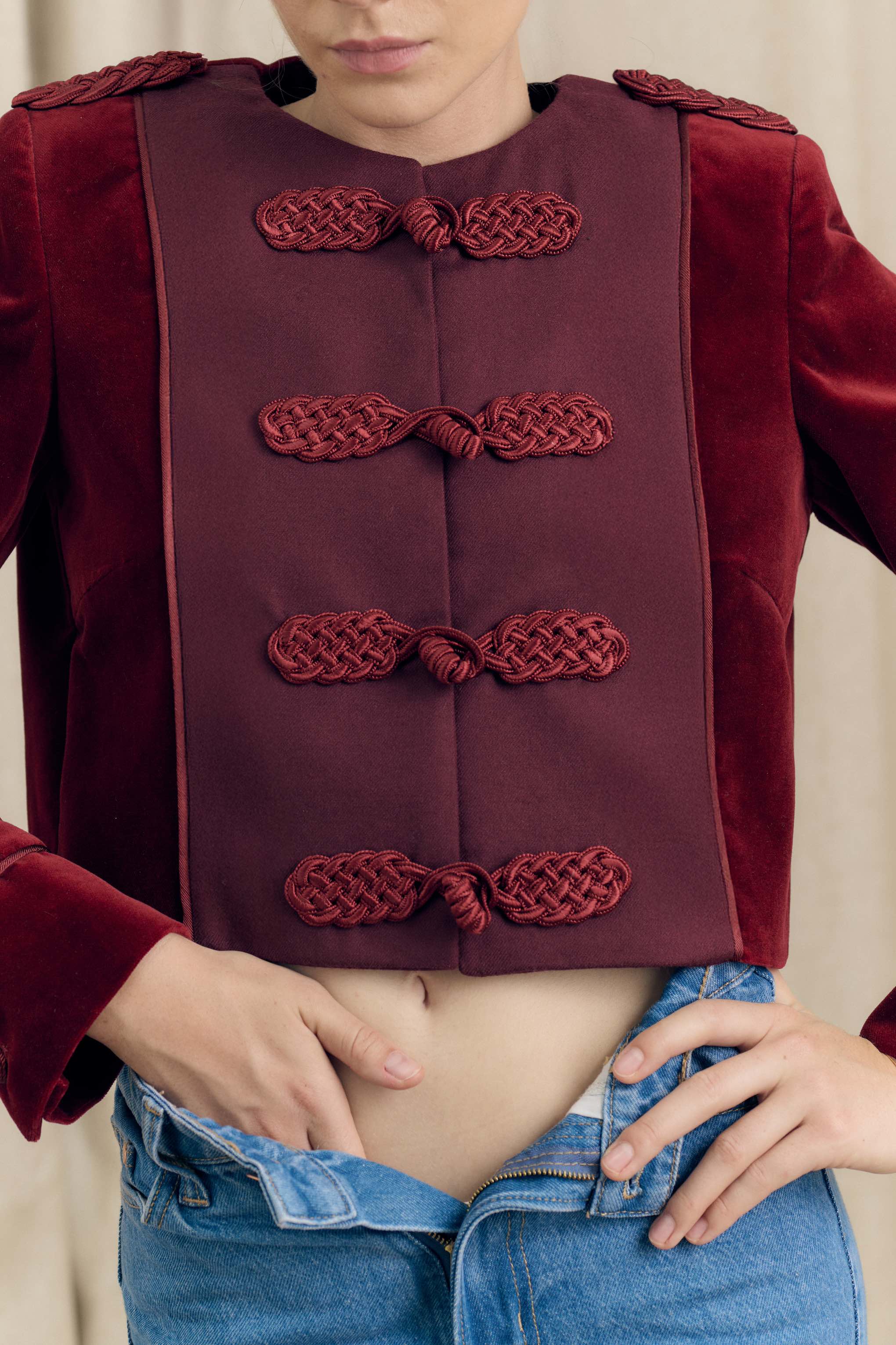 Close-up of Botteghe Oscure Brandebourg jacket front, flannel plastron with handmade braided frog closures and velvet structure.