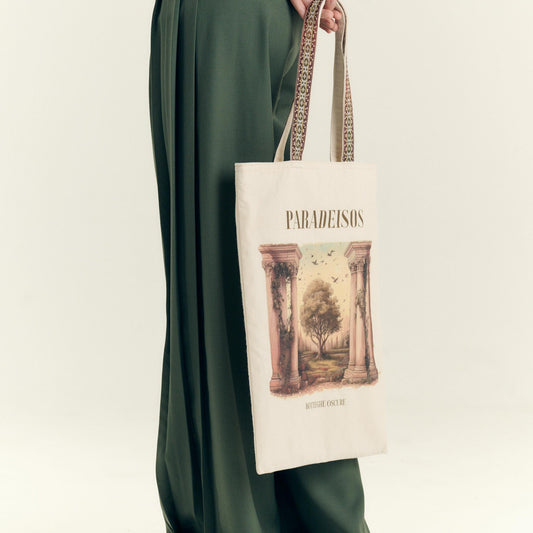 Model wearing the Paradeisos organic cotton and linen tote bag with vintage lurex trim by Botteghe Oscure