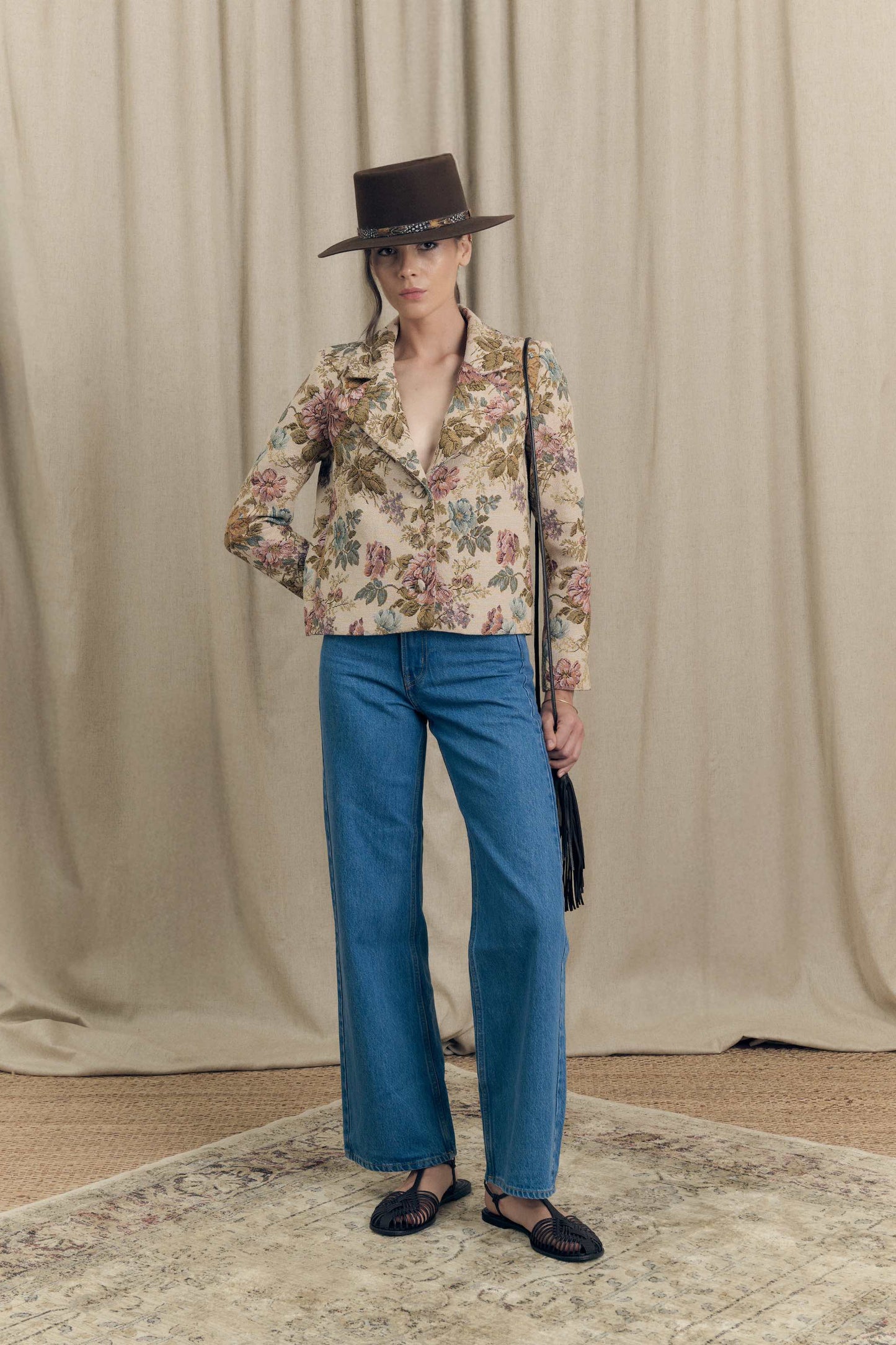 Front view of boxy floral jacquard blazer by Botteghe Oscure, vintage-inspired upholstery pattern with tailored construction and fabric-covered buttons