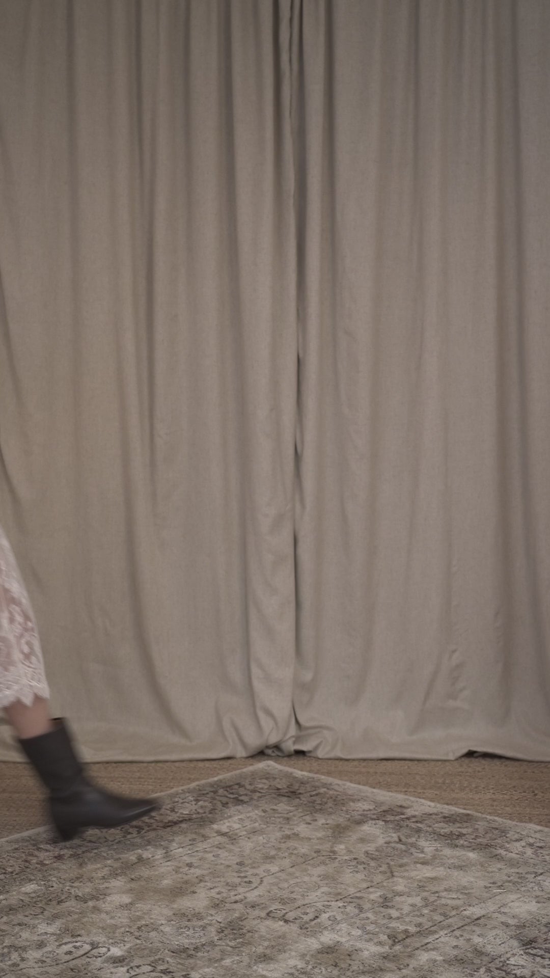 video of model wearing tweed oversized bomber jacket with velvet details and french chantilly midi skirt with silk petticoat by Botteghe Oscure