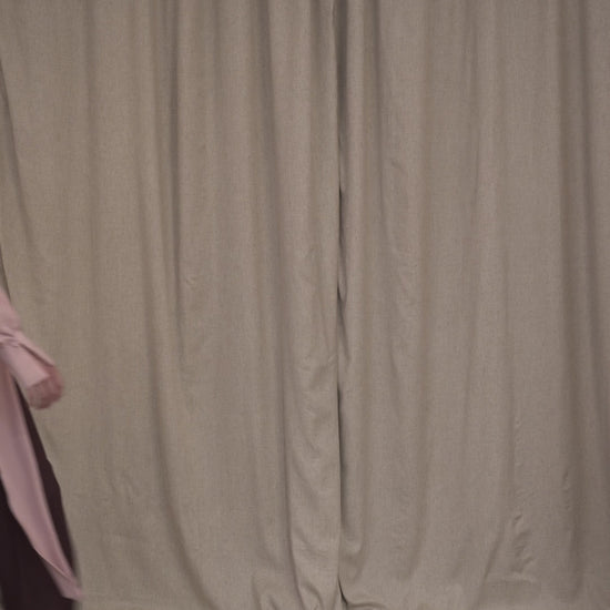 Video of model wearing silk pink blouse and burgundy glare cut tailored trousers by Botteghe Oscure