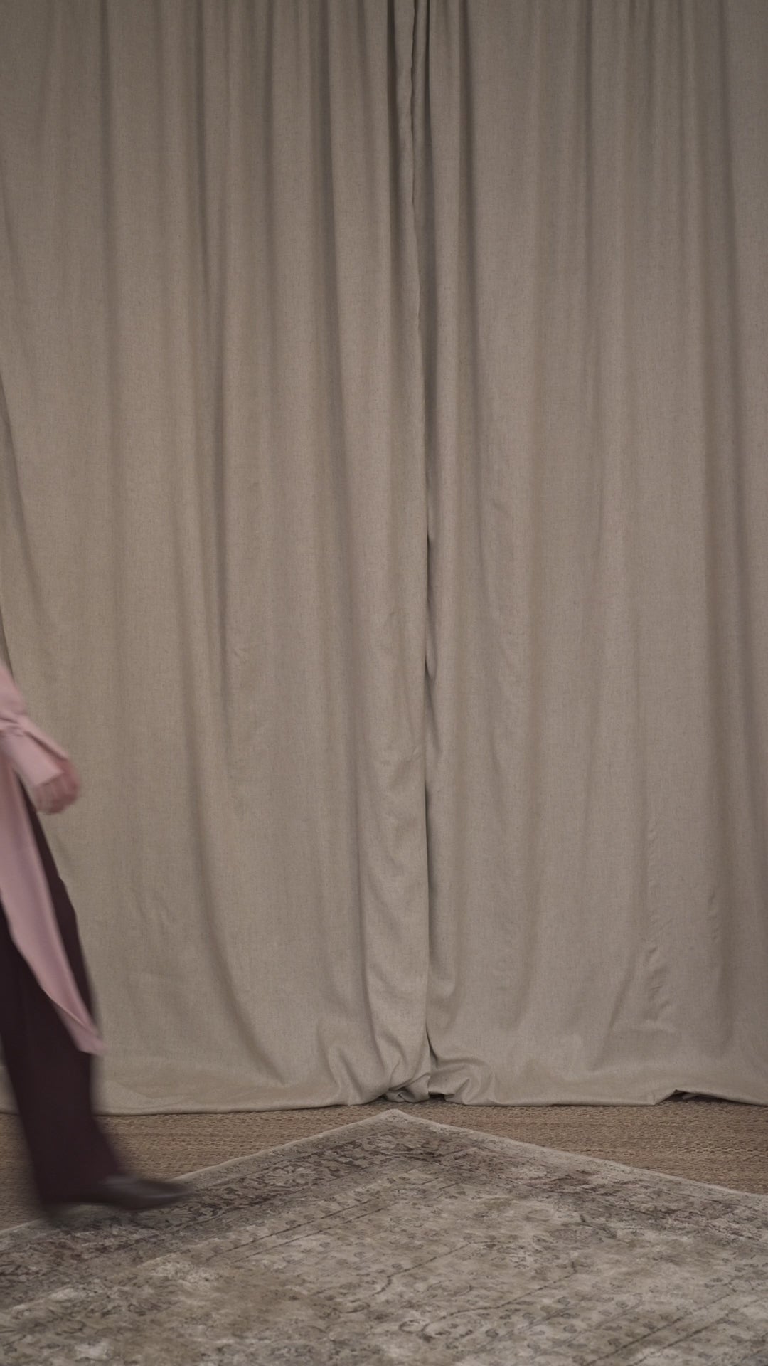 Video of model wearing silk pink blouse and burgundy glare cut tailored trousers by Botteghe Oscure