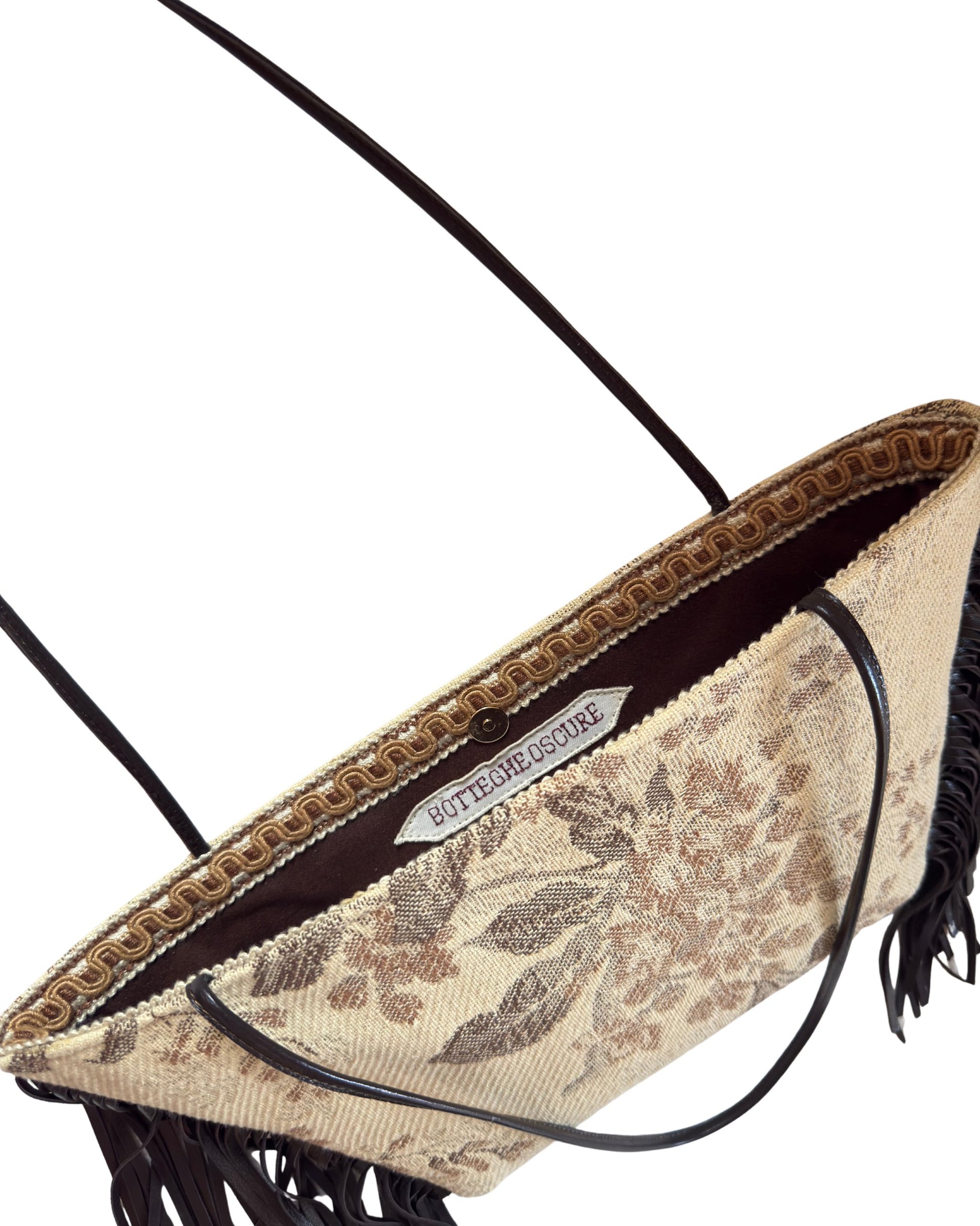 Detail of shoulder East-West bag in vintage jacquard fabric with leather details and fringes, one of a kind by Botteghe Oscure